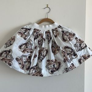 Monnalisa lion cub design, flair cut skirt with elastic waistband.